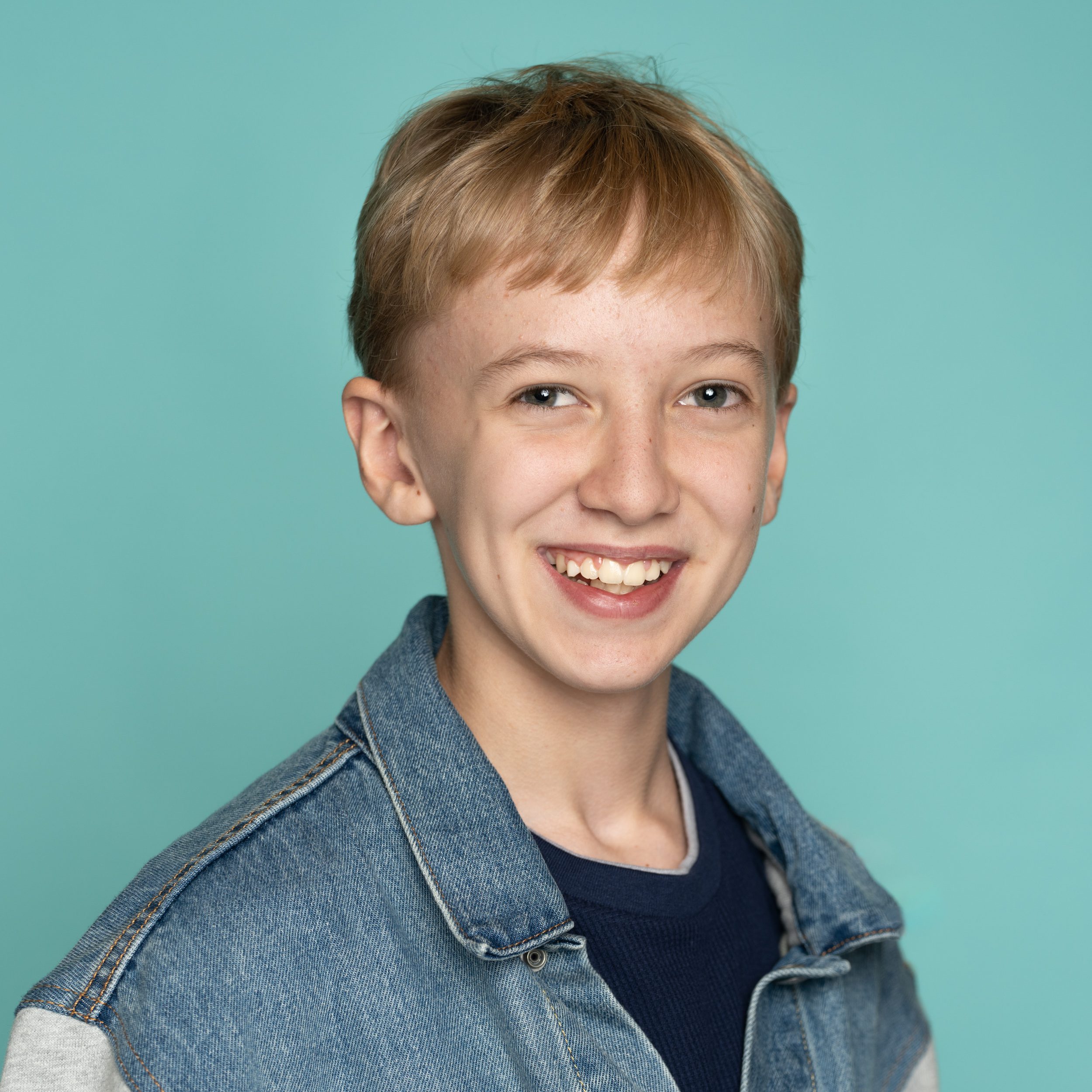 Boy in Front of a Light Green Background